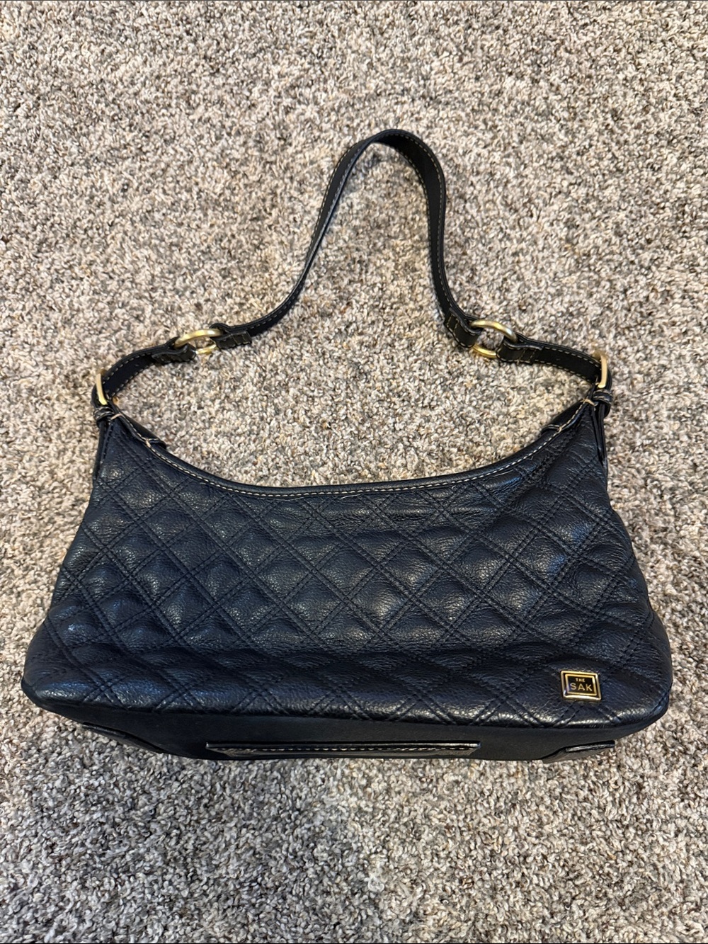 The Sak Black Quilted Leather Shoulder Bag with Gold Hardware
